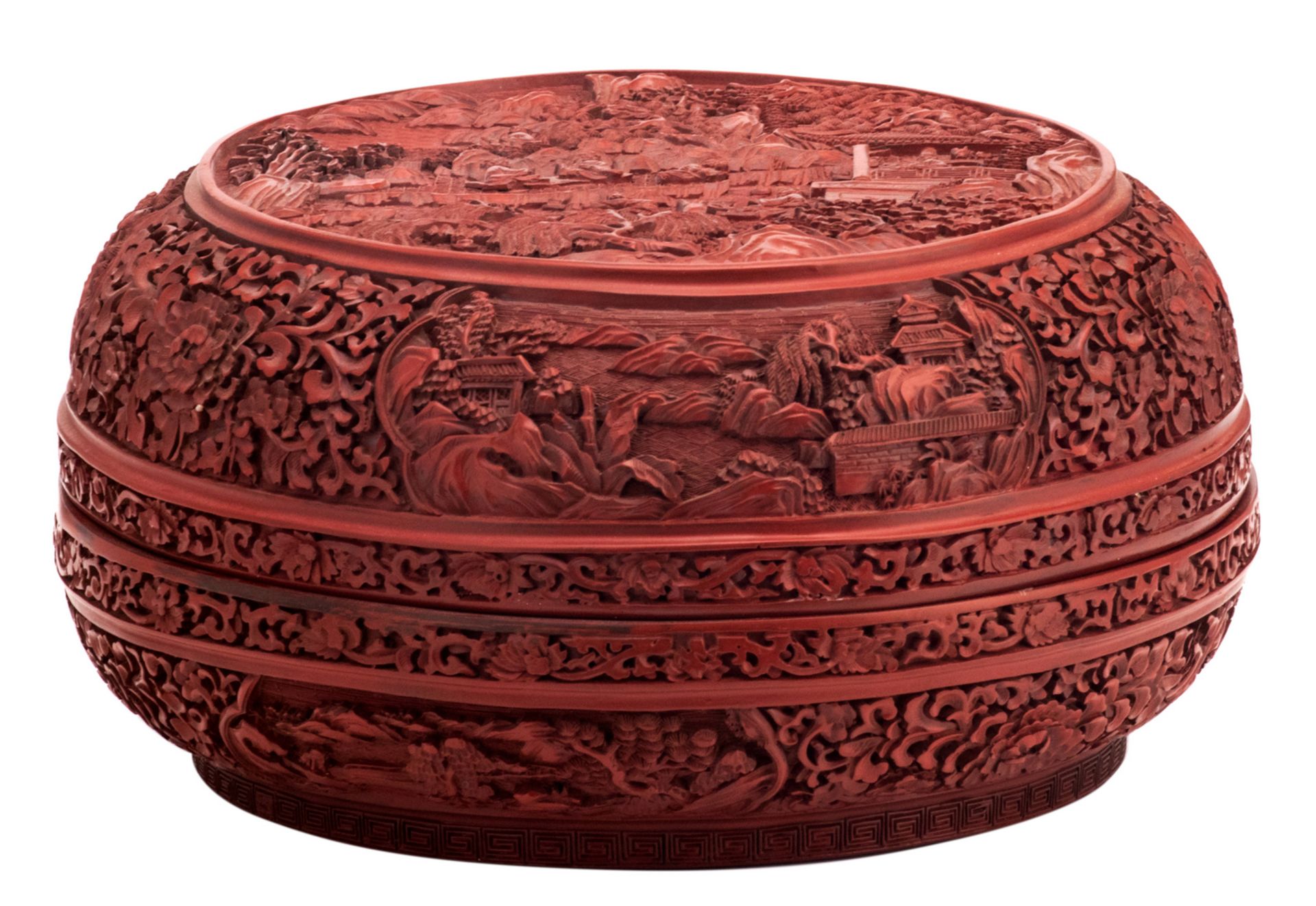 A fine Chinese red cinnabar lacquered bowl and cover, floral decorated, the roundels with