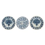 A pair of 18thC blue and white decorated Dutch Delftware plates, marked 'De Klauw'; added a marked