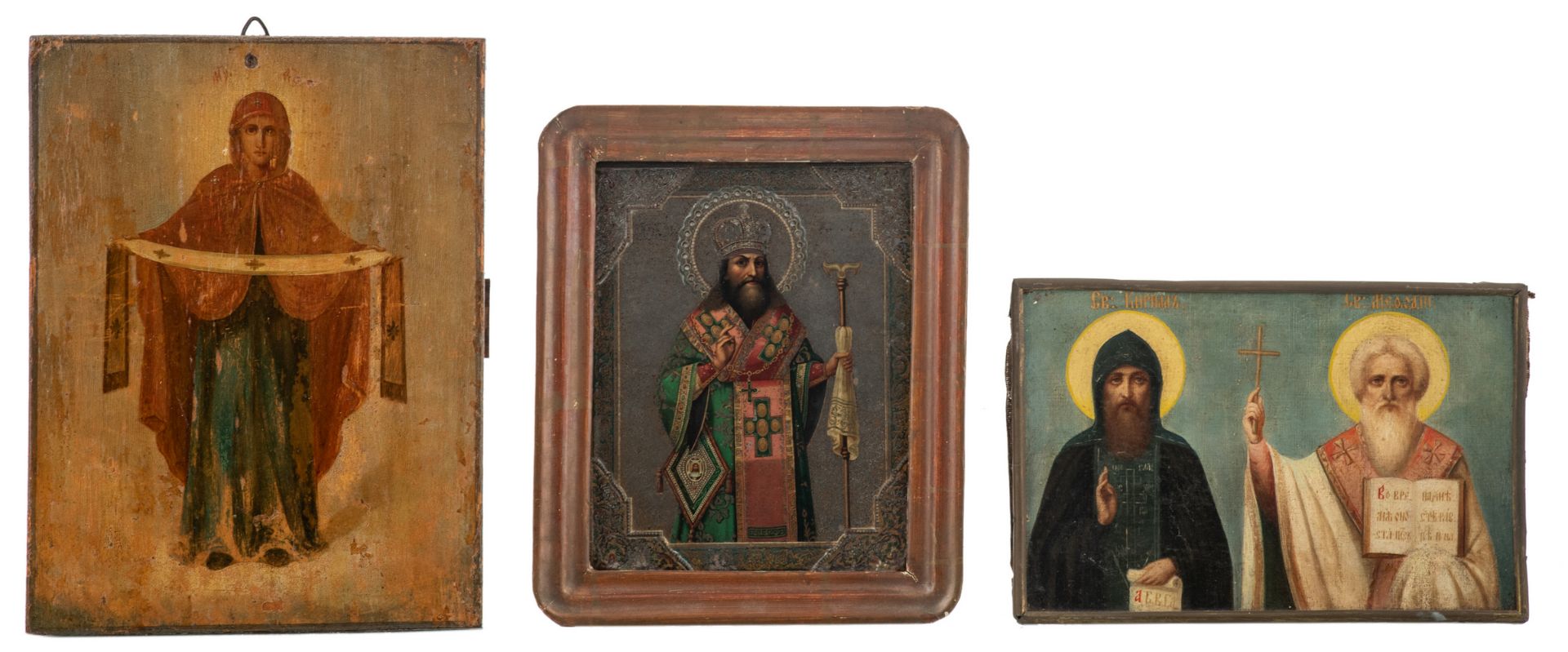 Three East European 19th / 20thC icons, one on wood, one on canvas, one a lithograph mounted in a