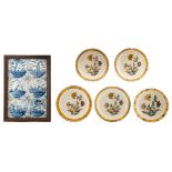 Five polychrome floral decorated Dutch Delftware plates; added a tile panel consisting of 18 blue