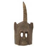 A traditional African wooden mask with on top a horn, Dogon - Mali, H 37 cm