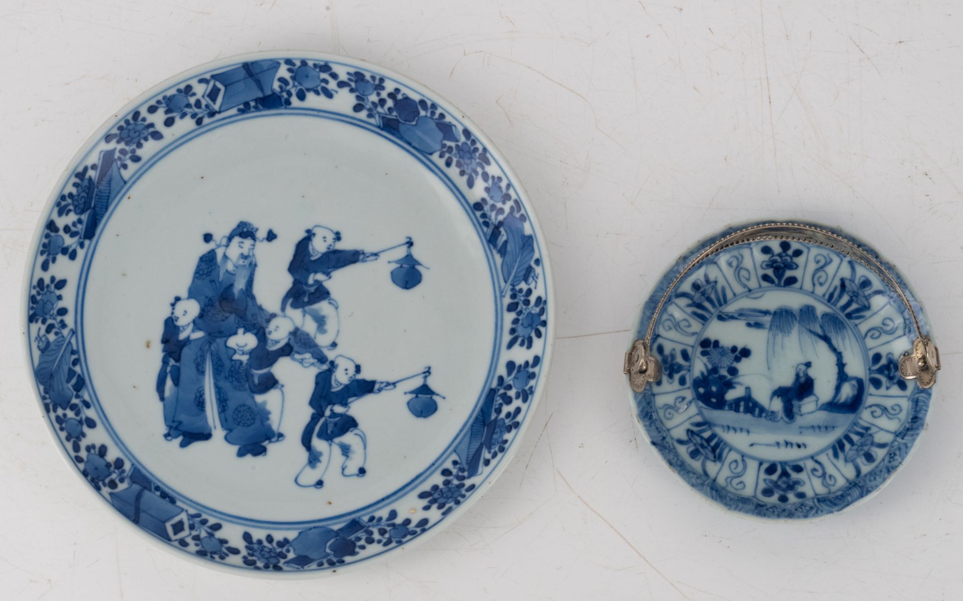 Two Chinese blue and white saucers, decorated with animated scenes, 18thC, one saucer with a Dutch - Image 14 of 15