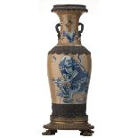 A Chinese blue and white brass mounted stoneware vase, decorated with a figure in a garden, with