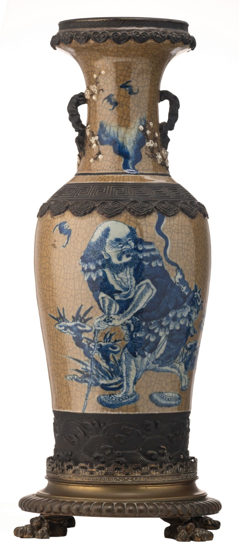 A Chinese blue and white brass mounted stoneware vase, decorated with a figure in a garden, with