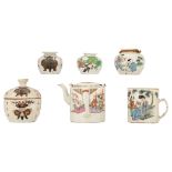 A Chinese tea pot, a jar and cover, three small jars and a mug, famille rose with different