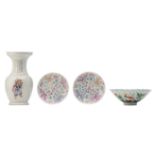 A lot of various famille rose and polychrome porcelain: a vase, a bowl and two saucers, all