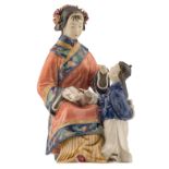 A Chinese polychrome glazed biscuit group, depicting a teacher and her pupil, marked, H 22 cm