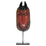 A traditional polychrome decorated African wooden mask, Guro - Ivory Coast, H 36 cm