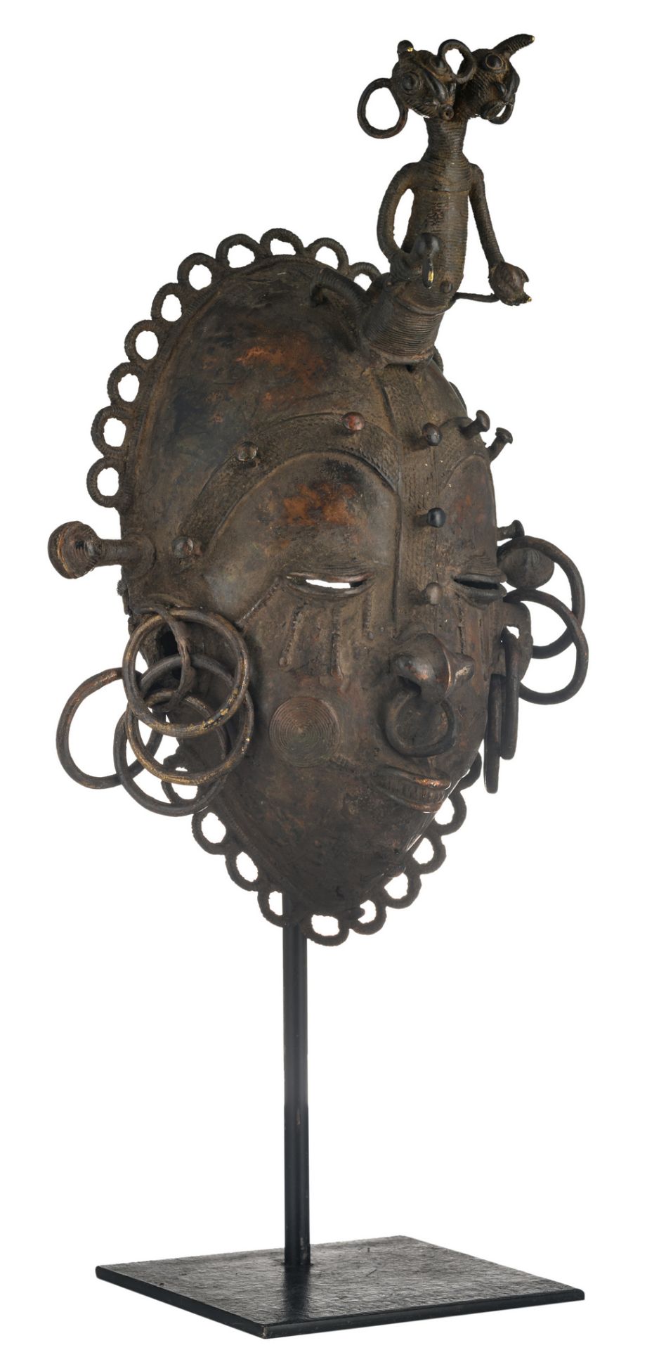 A traditional African patinated bronze mask, lost wax technique, Bamum - Cameroon, H 40,5 cm