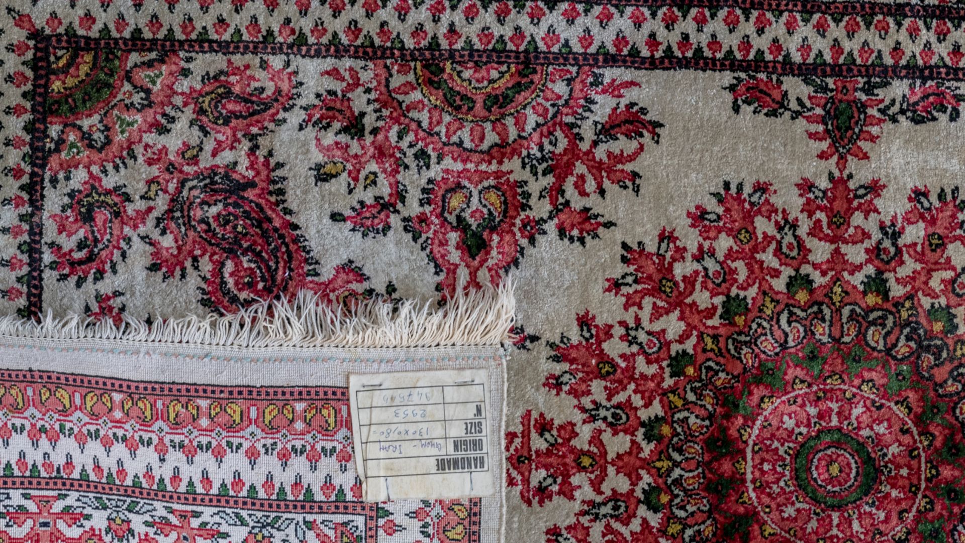 Three Oriental carpets with floral motifs and a central medallion, wool and silk on cotton, Ghom and - Image 5 of 5