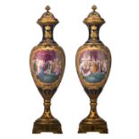 An important and impressive pair of generously gilt Sèvres vases and covers with gilt bronze mounts,