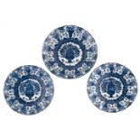 Two blue and white with a flower basket decorated Dutch Delftware plates and added a ditto bigger