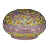 A Chinese yellow ground famille rose bowl and cover, decorated with dragons and a flaming pearl amid