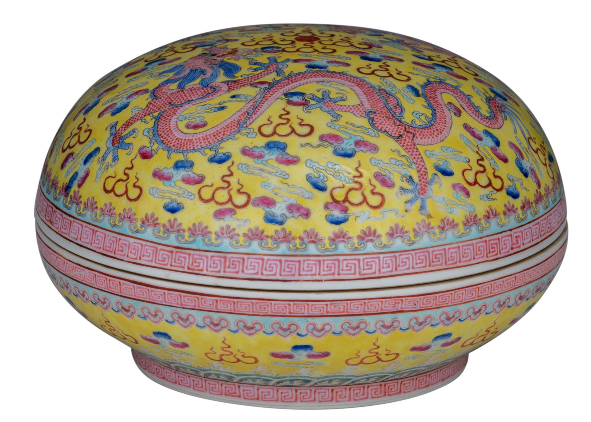 A Chinese yellow ground famille rose bowl and cover, decorated with dragons and a flaming pearl amid