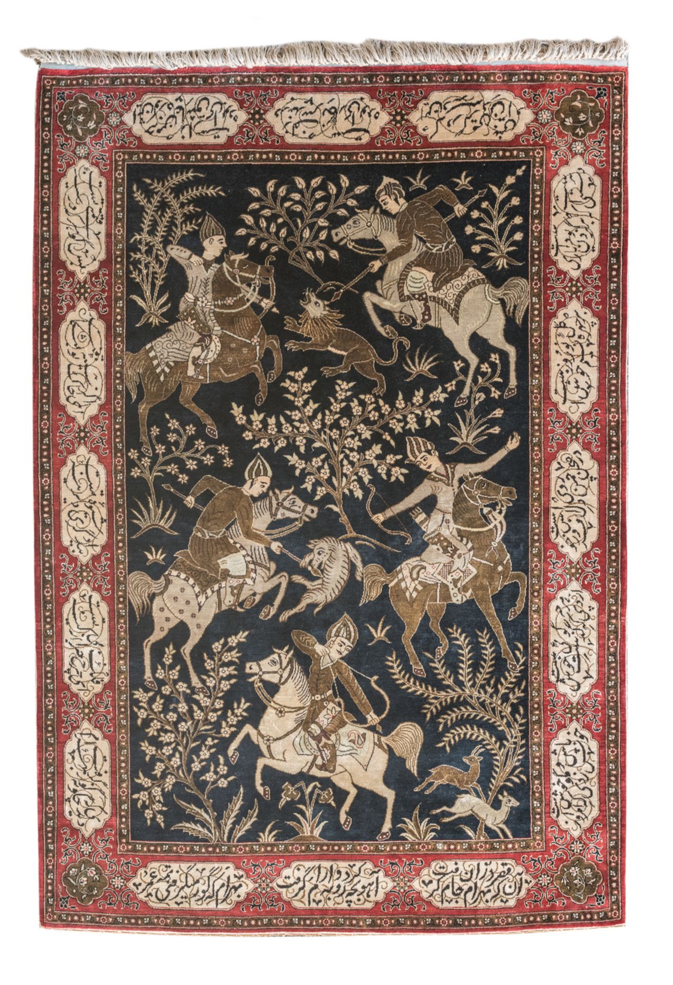 An Oriental silk carpet decorated with a hunting scene, the roundels with calligraphic inscriptions,