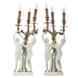 A pair of Sèvres biscuit candelabras with a gilt bronze mount, depicting two graces in the Clodion