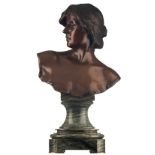 Jespers E., a bust of a lady, patinated bronze on a vert de mer marble base, marked 'Cie des Bronzes