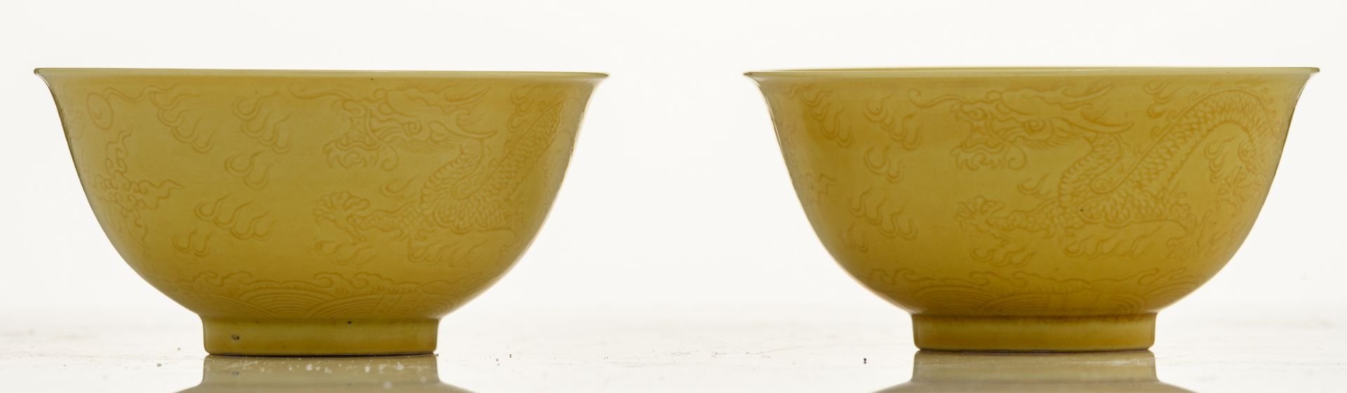 A pair of Chinese yellow glazed imperial bowls, with incised dragons on the outside, marked - Image 2 of 8
