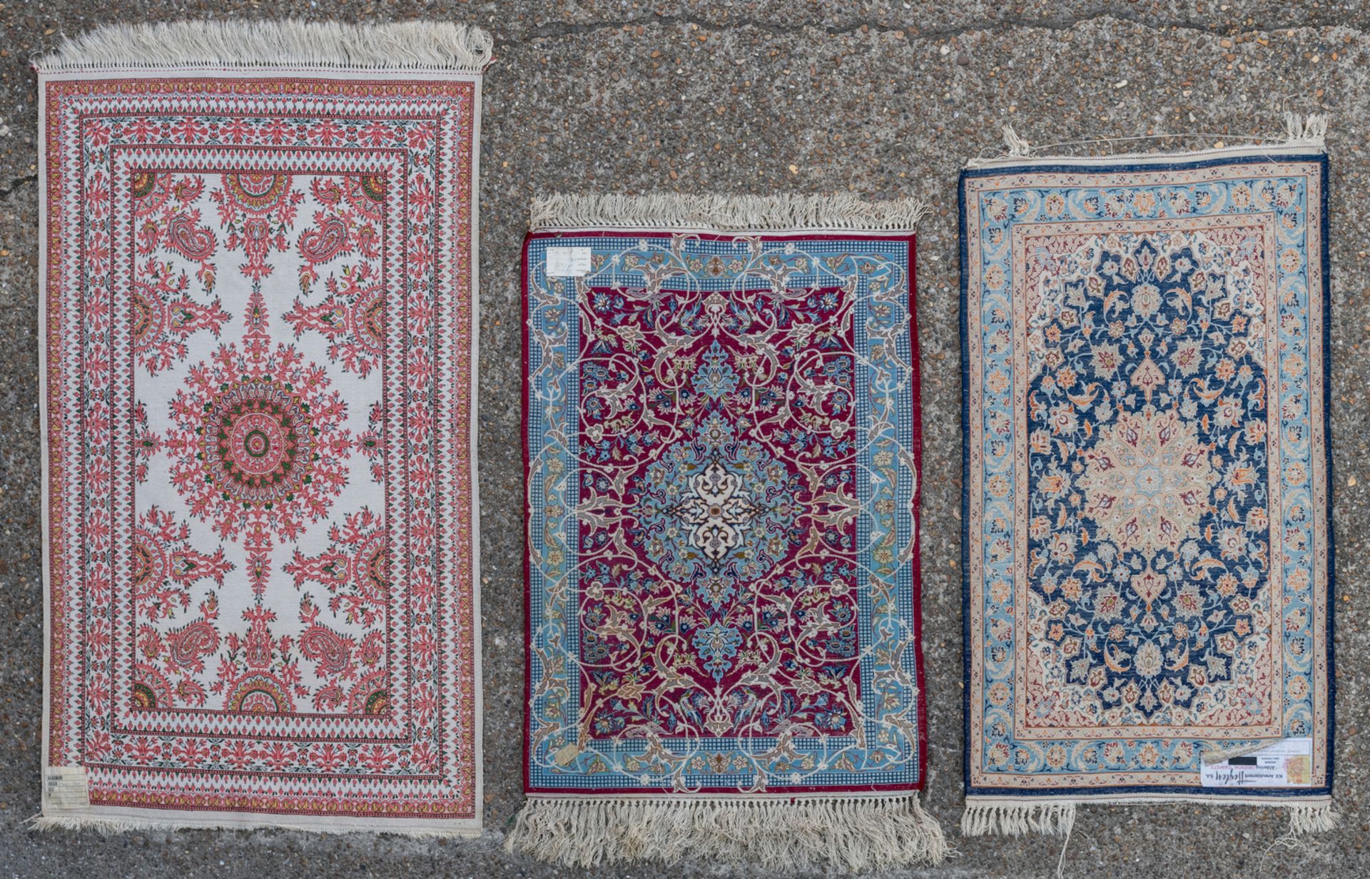 Three Oriental carpets with floral motifs and a central medallion, wool and silk on cotton, Ghom and - Image 2 of 5