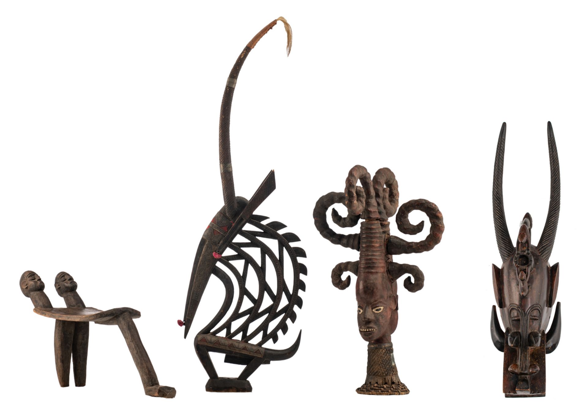 Four decorative African wooden items, different regions and tribes: a chair, a polychrome