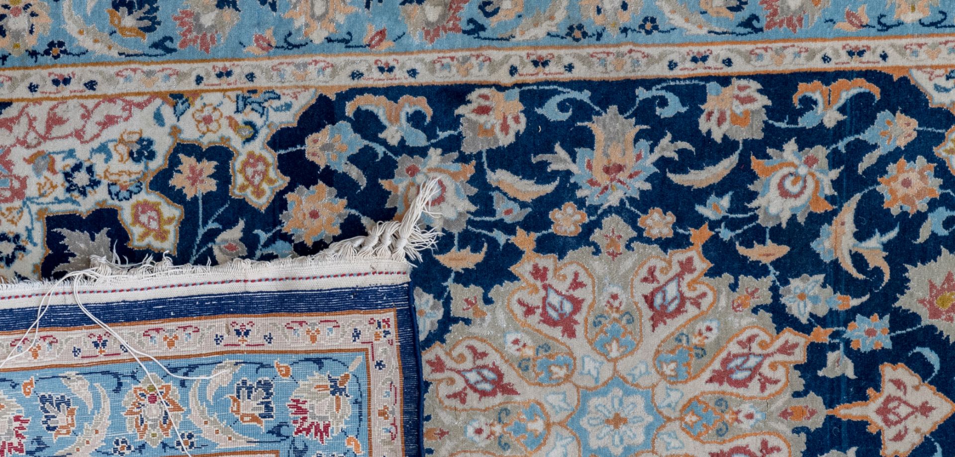 Three Oriental carpets with floral motifs and a central medallion, wool and silk on cotton, Ghom and - Image 3 of 5