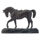 A patinated bronze figure of a horse, with Chinese calligraphic inscriptions, on a matching carved