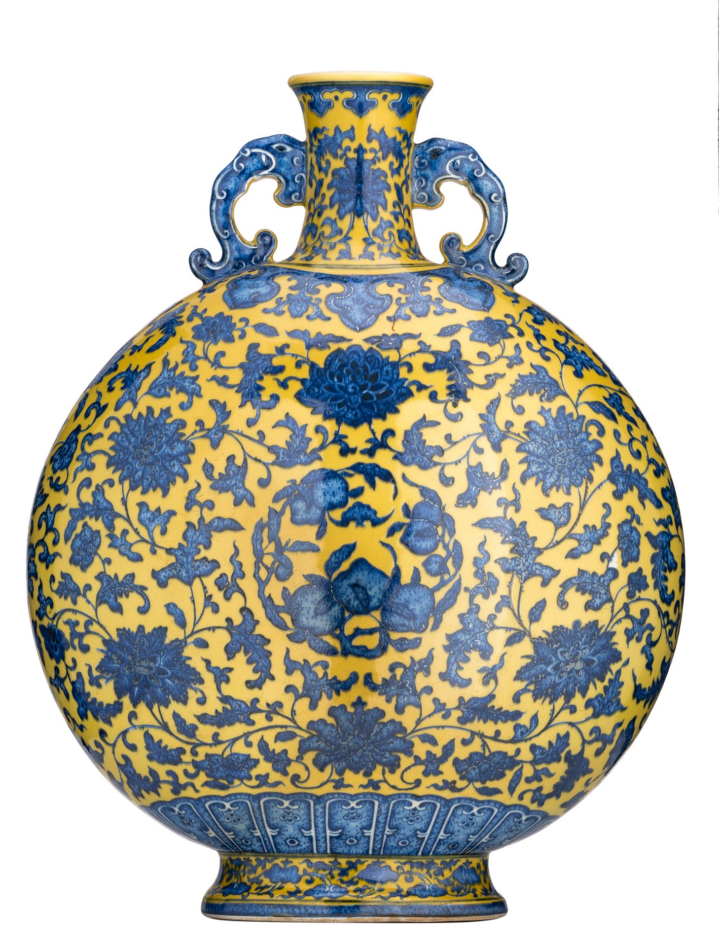 A Chinese yellow ground blue and white moon flask, decorated with scrolling lotus and peaches,