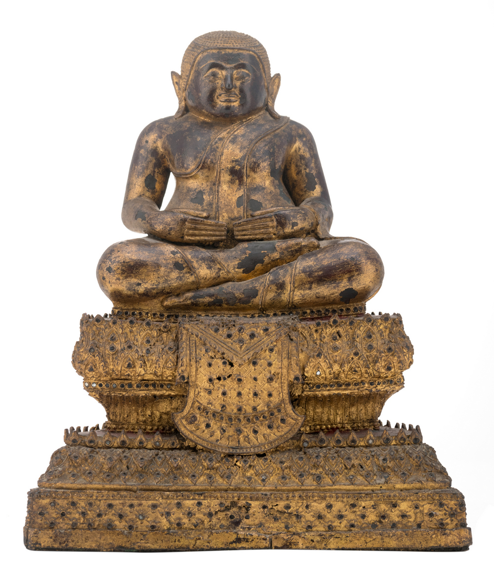 A Thai gilt and polychrome lacquered bronze seated Buddha on a multi-stepped base, with glass inlay,