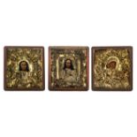 Three East European 19th / 20thC icons, set with a gilt metal reza, 32,5 x 35,5 cm