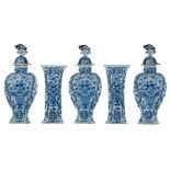 An 18thC Dutch Delftware blue and white five-piece garniture decorated with floral motifs, H 31 - 41