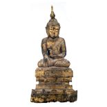 A Burmese gilt lacquered carved wooden seated Buddha on a multi-stepped base, 19thC, H 84,5 cm