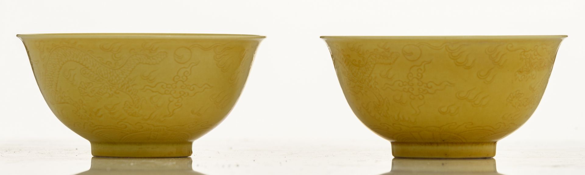 A pair of Chinese yellow glazed imperial bowls, with incised dragons on the outside, marked - Image 4 of 8