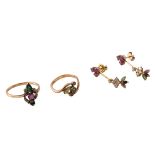 A three-part 18ct golden set of a pair of earrings and a ring, all set with ruby, emerald and