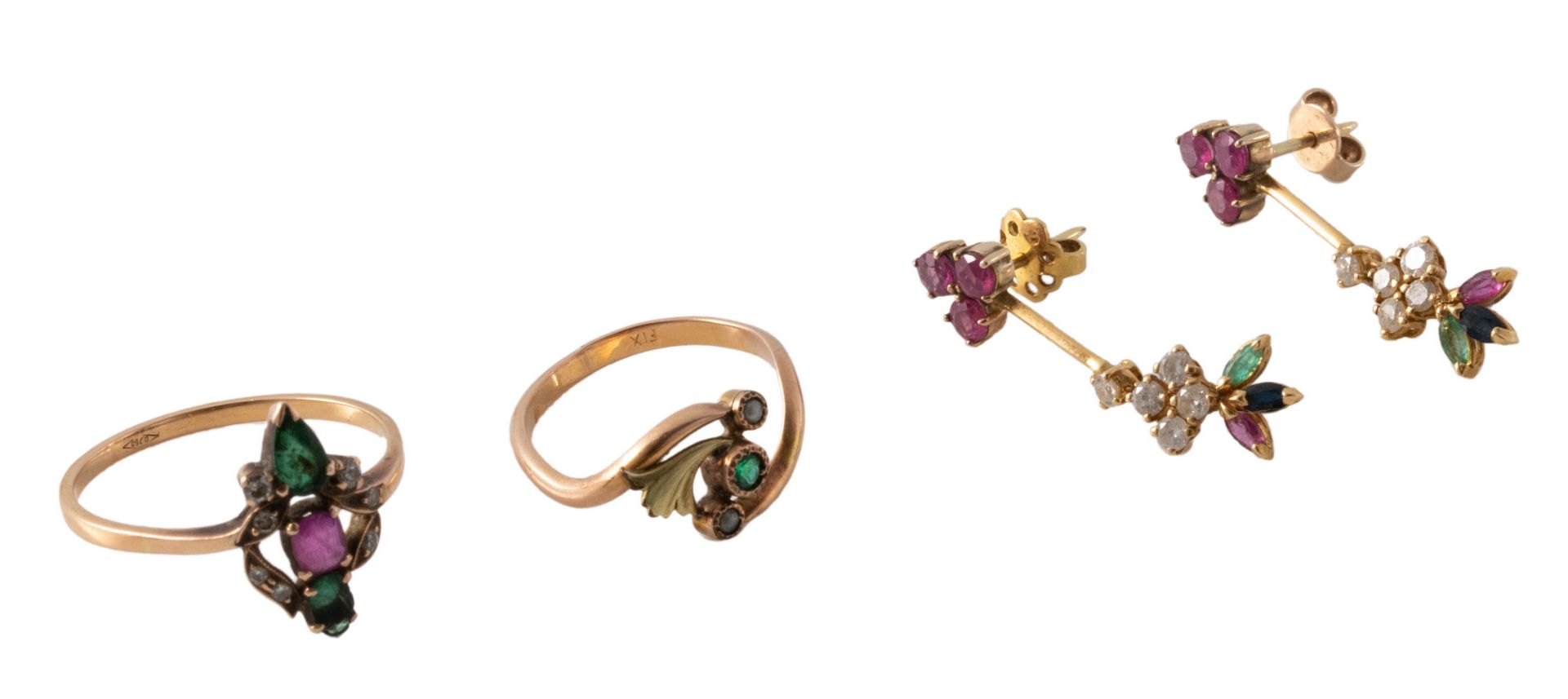 A three-part 18ct golden set of a pair of earrings and a ring, all set with ruby, emerald and