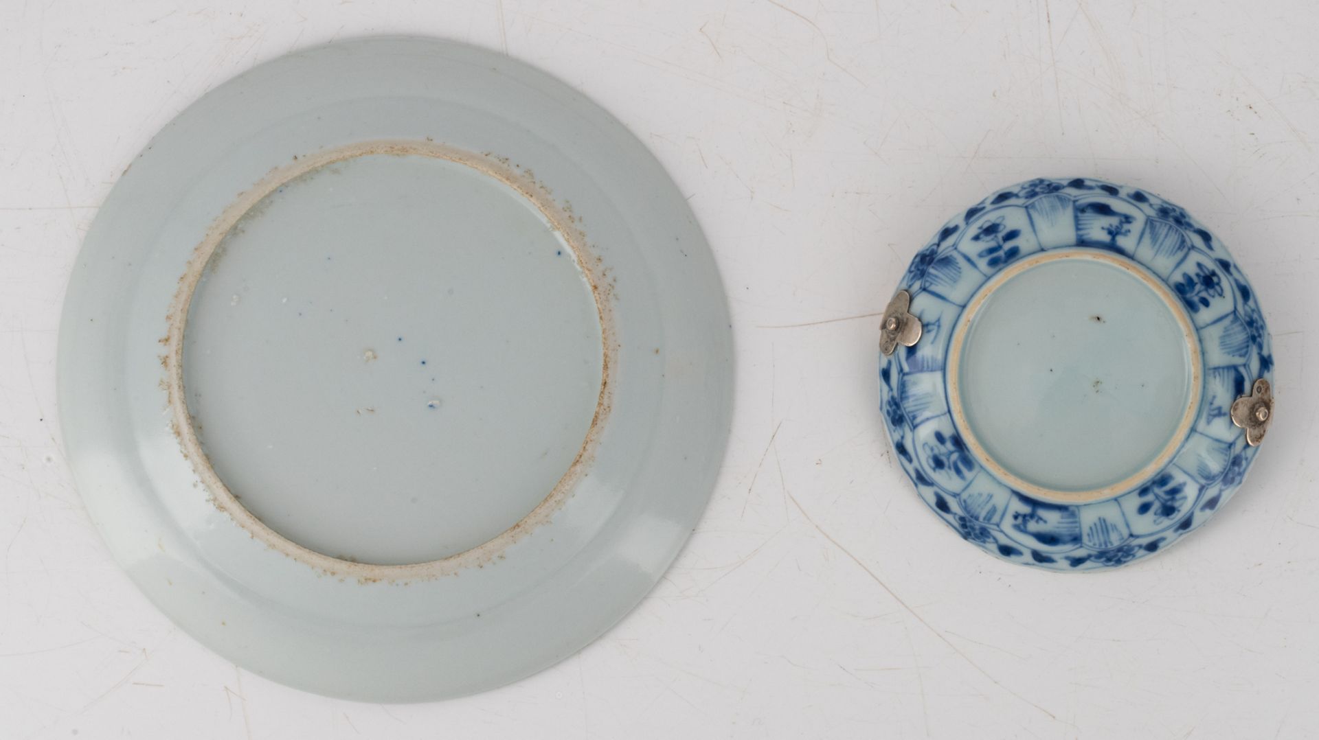 Two Chinese blue and white saucers, decorated with animated scenes, 18thC, one saucer with a Dutch - Image 15 of 15