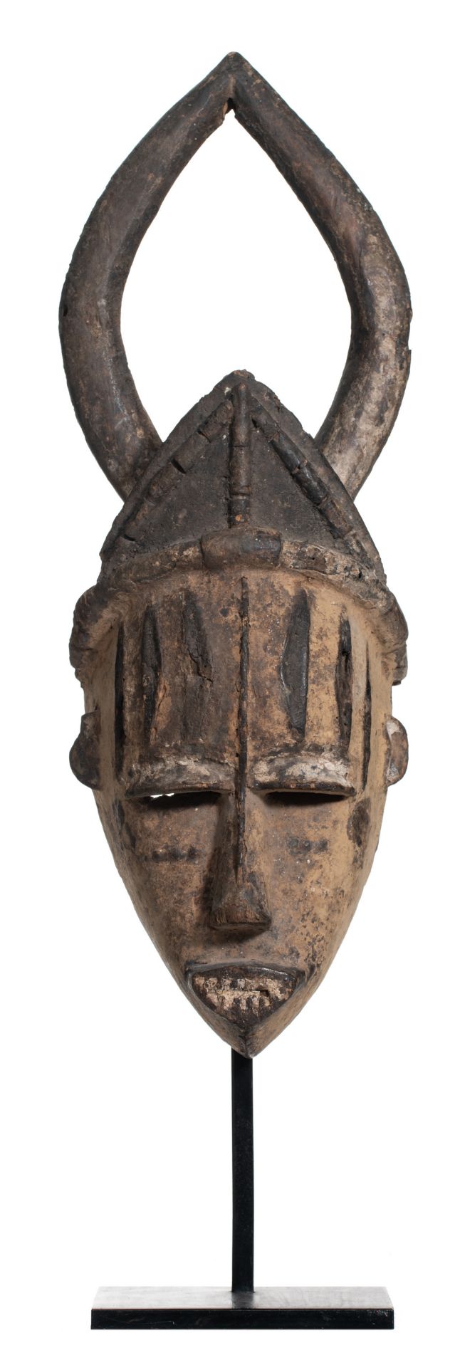 A traditional African polychrome decorated wooden mask, Urhobo - Nigeria, H 44 cm