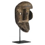 A traditional African wooden mask depicting a monkey, Kran - Ivory Coast, H 33,5 cm