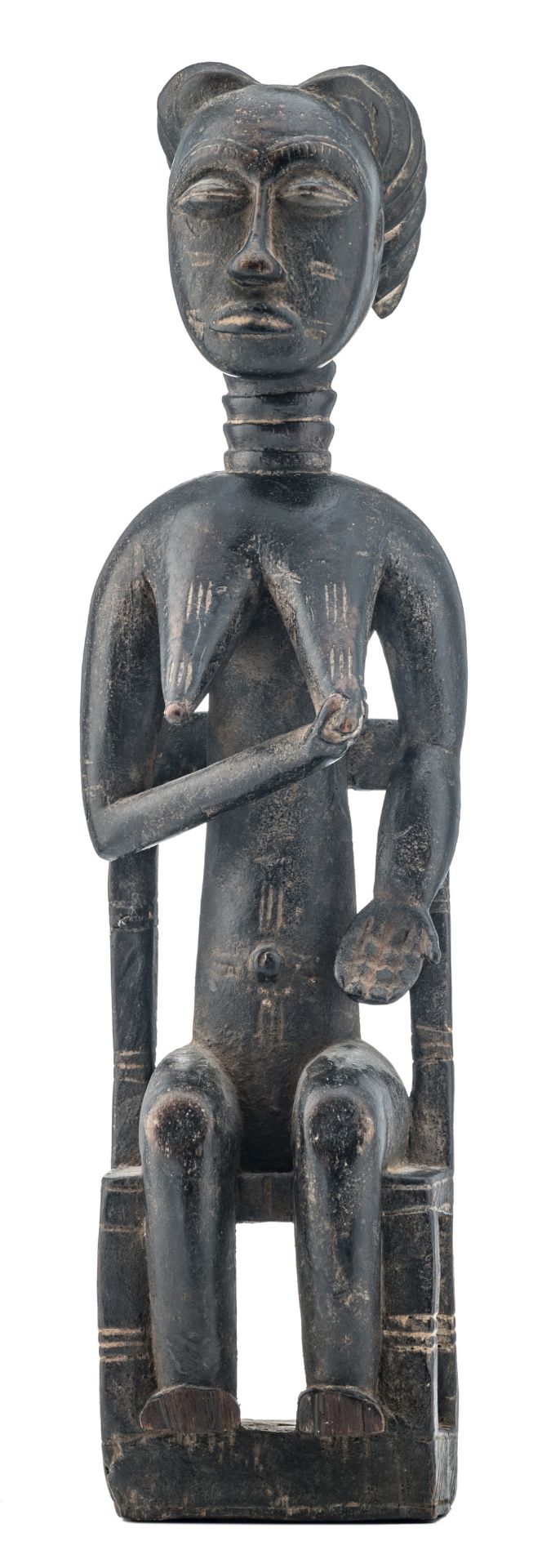 An African wooden sculpture depicting a seated female figure, Hemba - Congo, H 53,5 cm