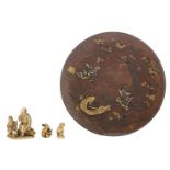 A beautiful Japanese patinated bronze and relief worked charger, engraved and with gilt details,