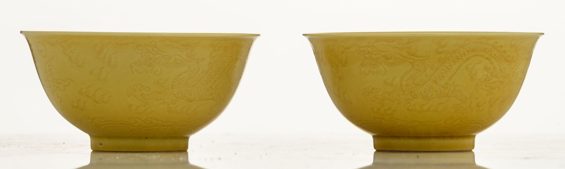 A pair of Chinese yellow glazed imperial bowls, with incised dragons on the outside, marked - Image 3 of 8