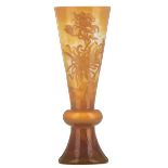 A multilayered vase in the Art Nouveau manner, decorated with spider mum flowers, marked '