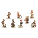Eight Goebel and Hummel figurines, mainly depicting children with their favorite animal, 1947-