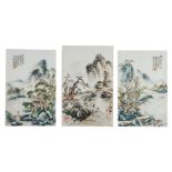 Three Chinese polychrome plaques, depicting figures in a mountainous river landscape, two plaques