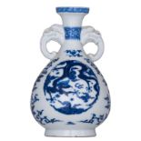 A Chinese blue and white bottle vase, the roundels decorated with a dragon and a mythical bird,