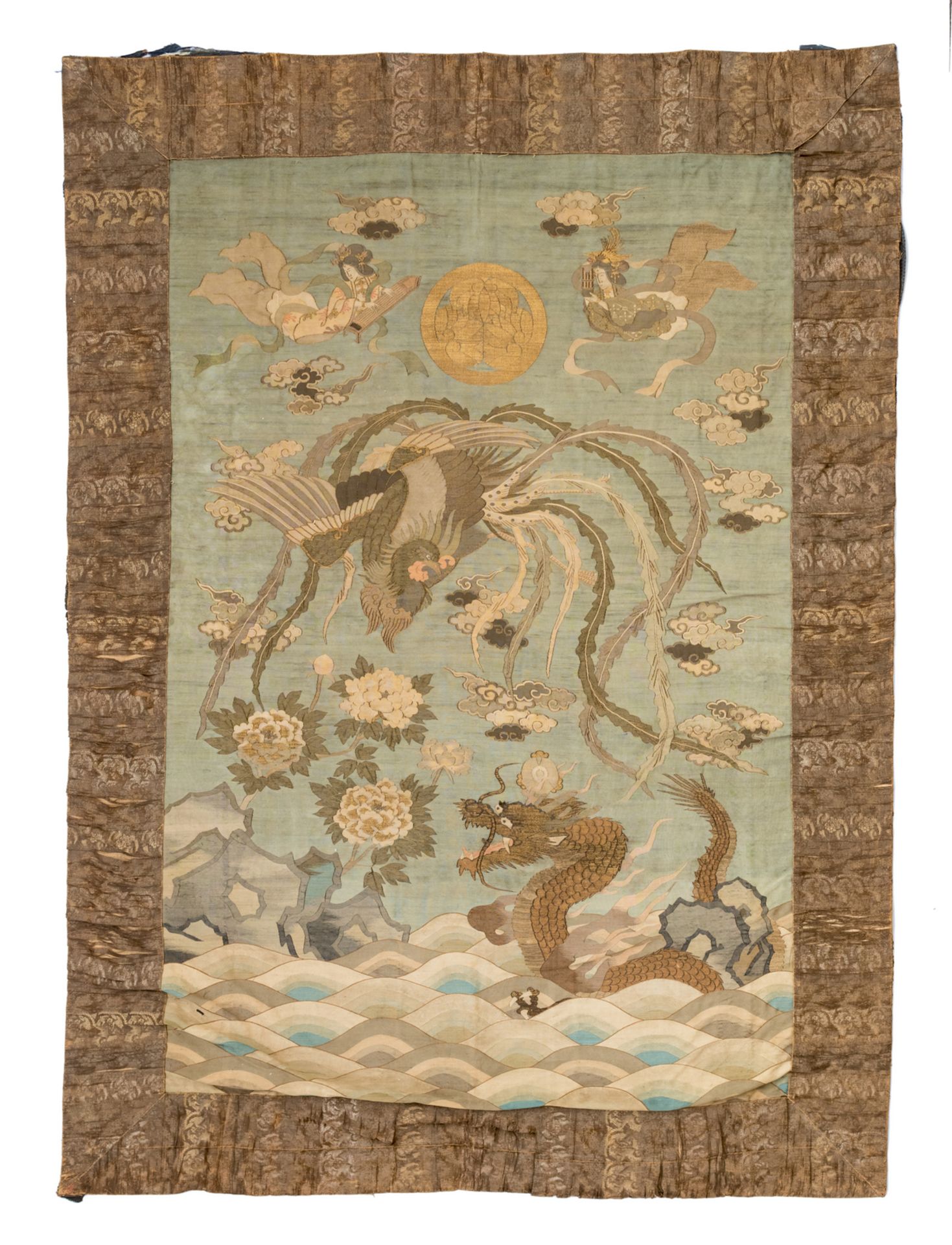 A fine Japanese embroidered silk and gold thread wall tapestry, depicting a dragon holding a flaming