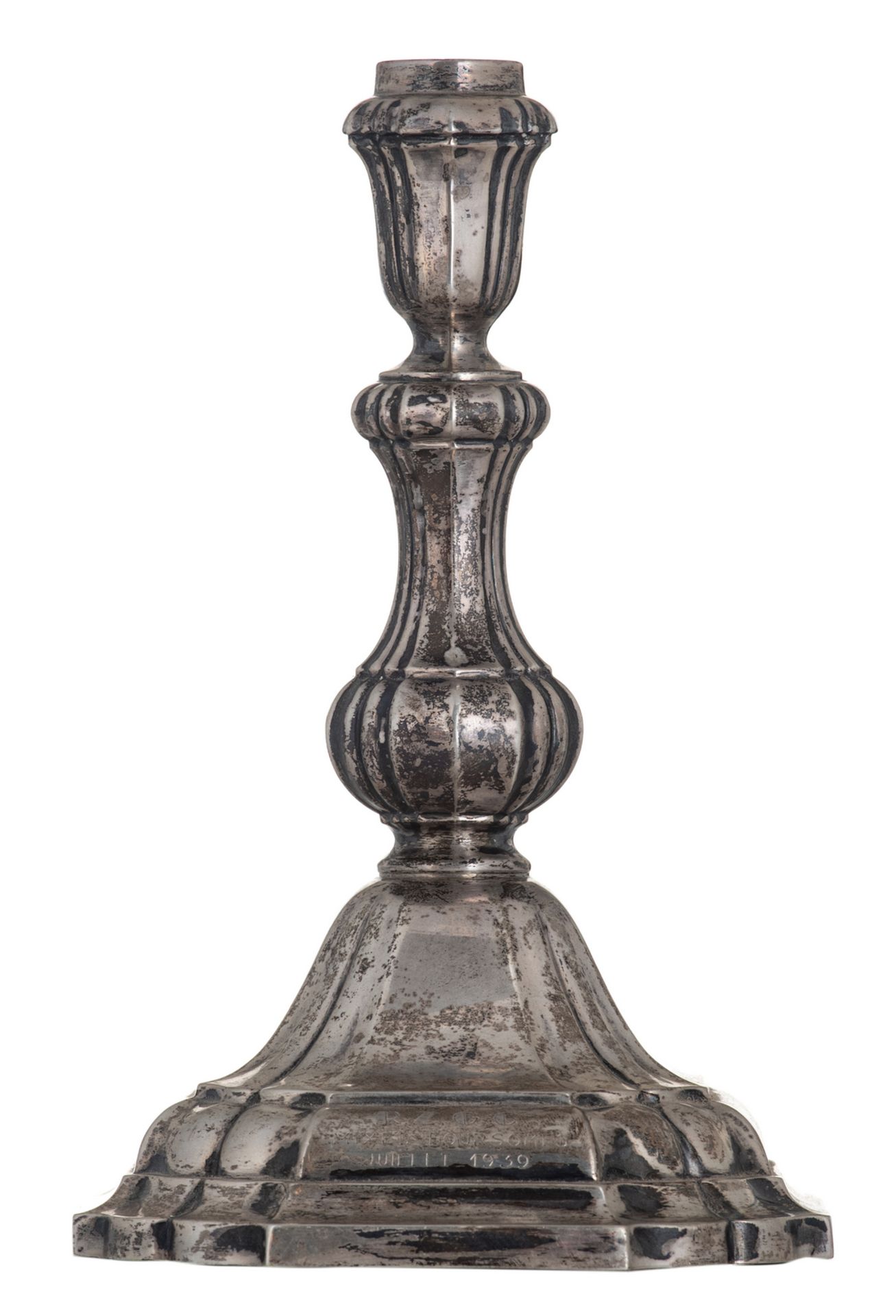 A German baroque style silver candlestick, late 19th - early 20thC, with an engraving: 'Juillet 1939