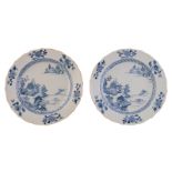 Two Chinese blue and white floral decorated barbed rim dishes, the well with a river landscape,