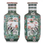 A pair of Chinese famille verte rouleau shaped vases, the roundels decorated with mythical birds,