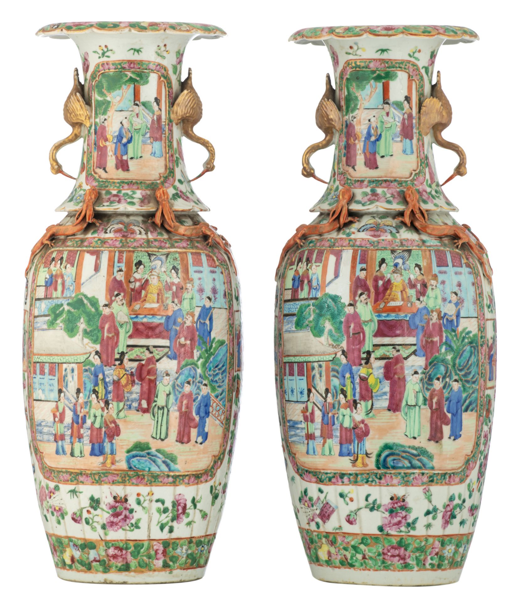 A pair of Chinese famille rose and dragon relief decorated Canton vases, the roundels with court