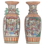 A pair of Chinese ironred and famille rose vases, the panels decorated with court scenes and